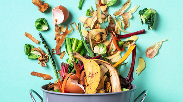 cooking pot with food falling into