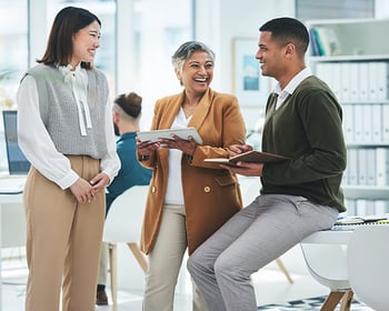 people having a conversation in an office setting