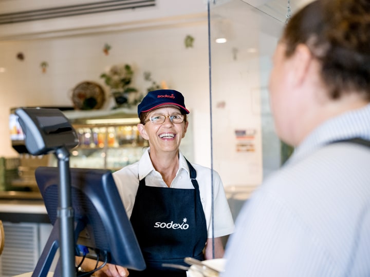 female cashier smiling