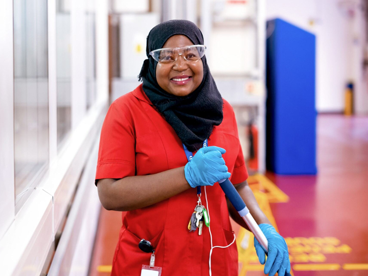 woman cleaning smiling