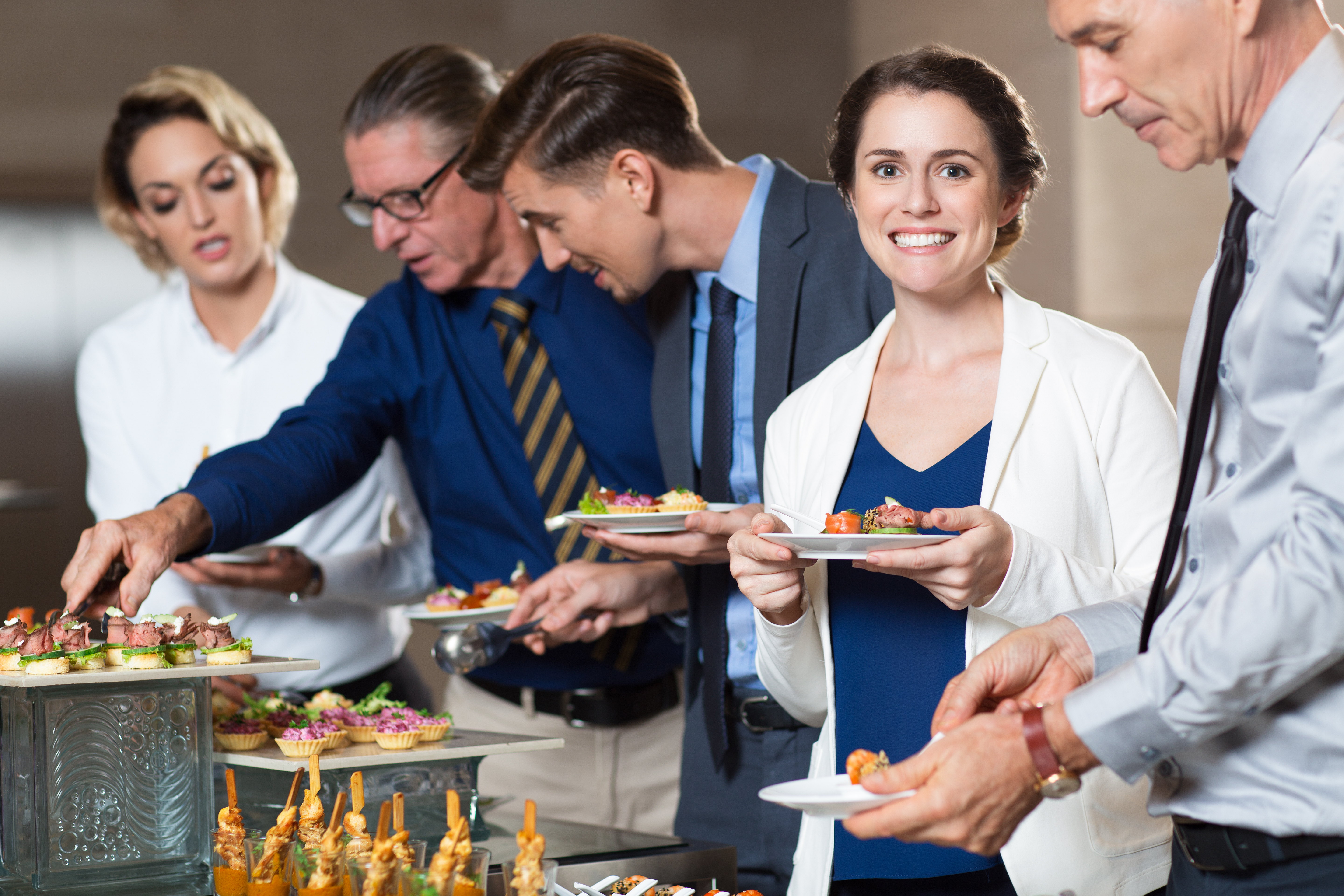 business-people-taking-snacks-from-buffet-table