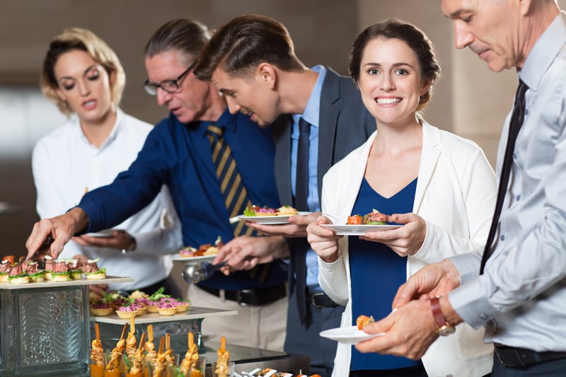 business-people-taking-snacks-from-buffet-table