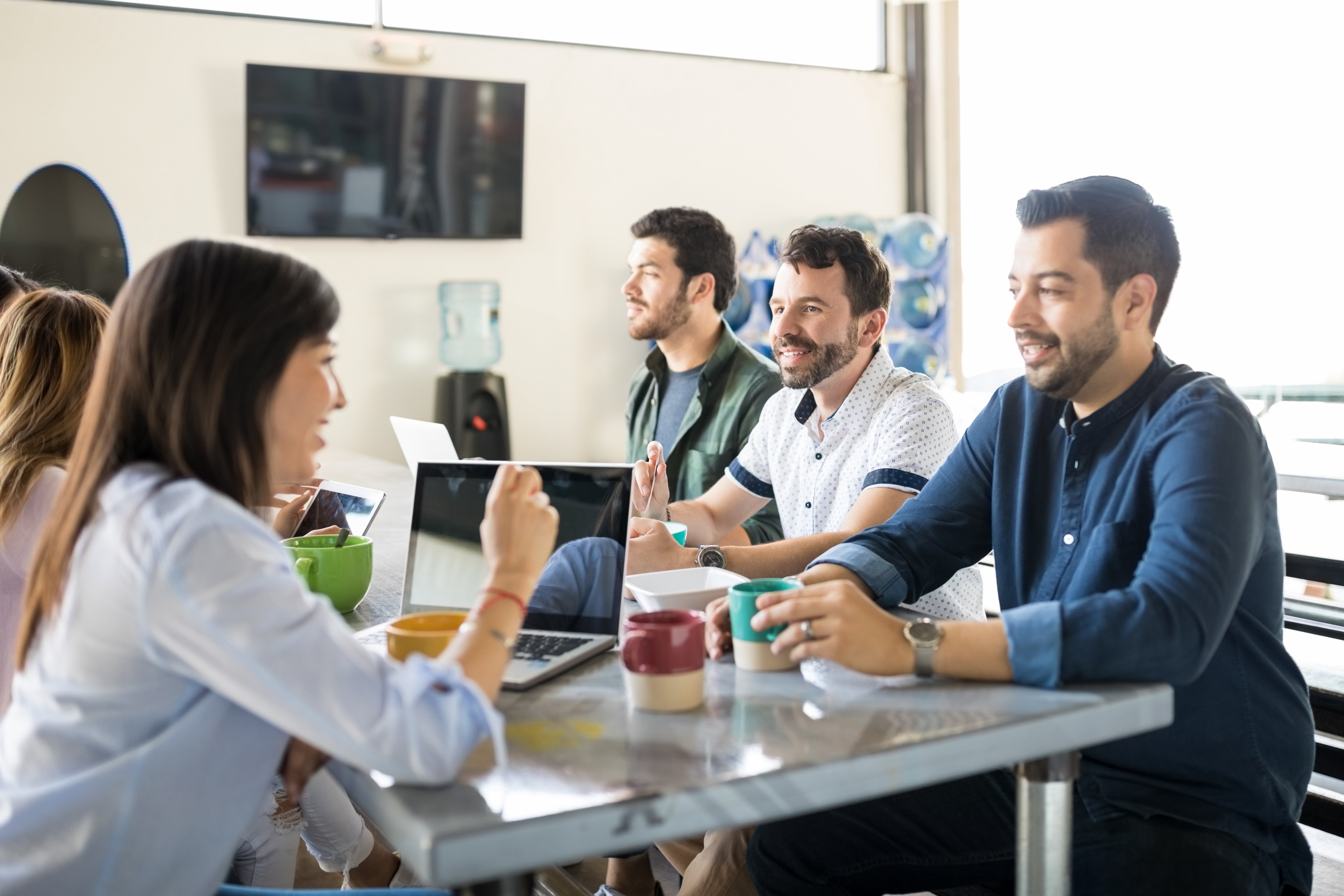 group-young-coworkers-having-food-drinks-cafeteria