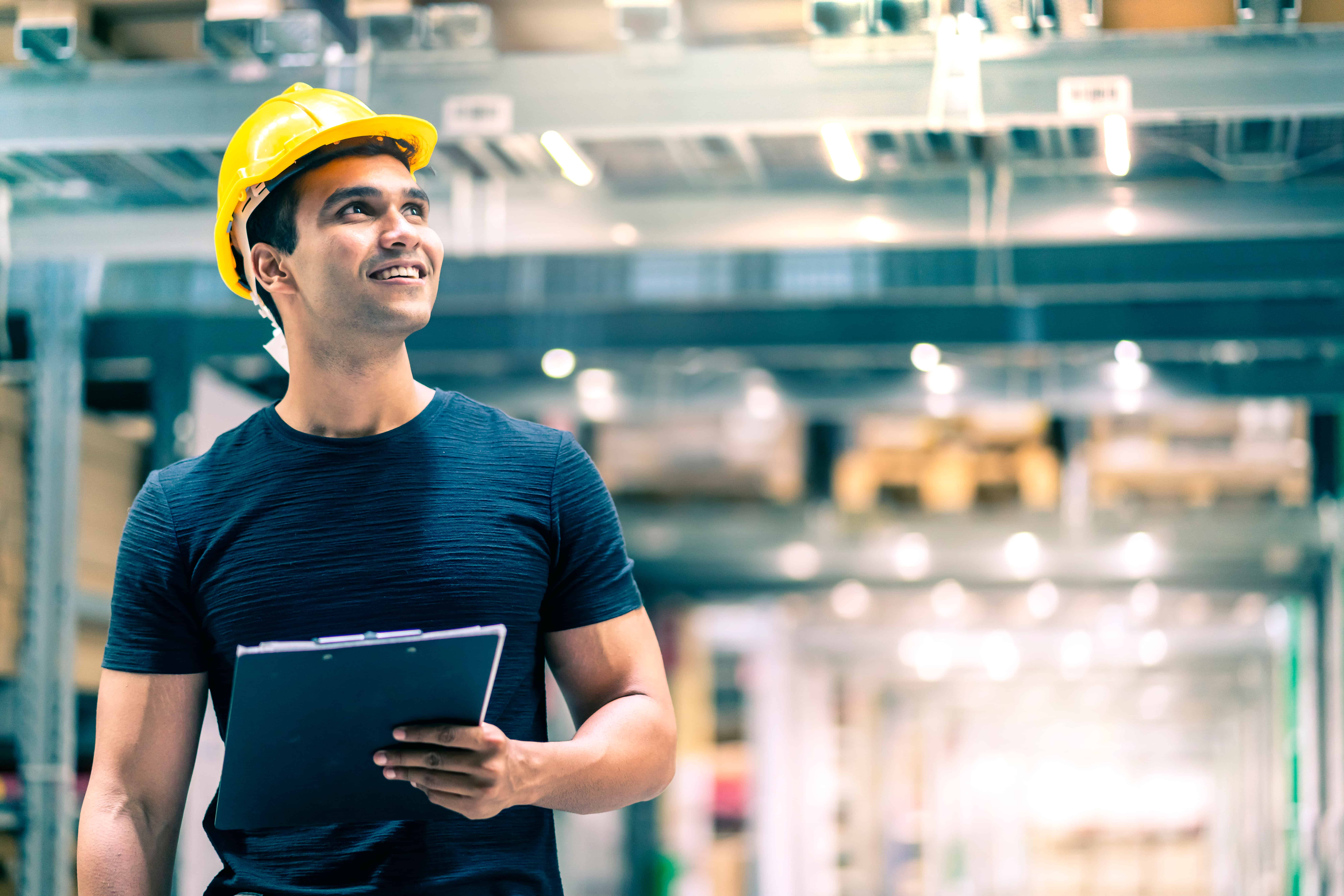 smart-indian-engineer-man-wearing-safety-helmet-doing-stock-tick-check-cardboard-stock-product-management-factory-warehouse-background (1)