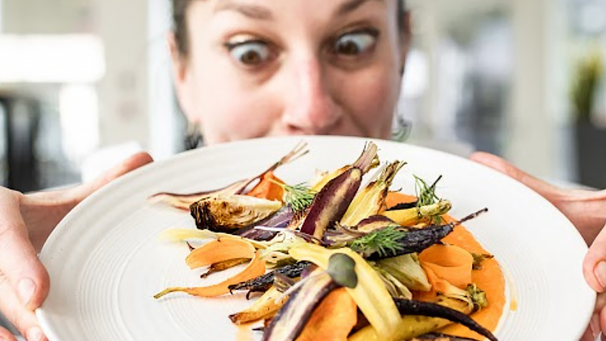 White woman showing a dish