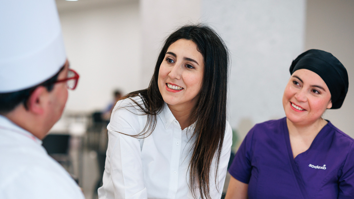 3 women talking and smiling