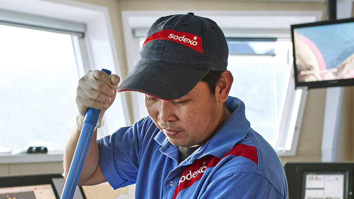 a sodexo worker cleaning