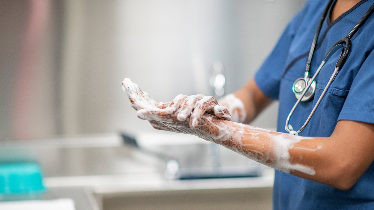 a doctor cleaning his hands