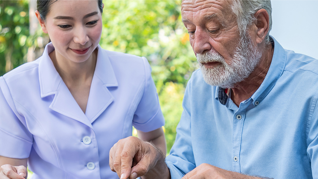 nurse accompanying older man