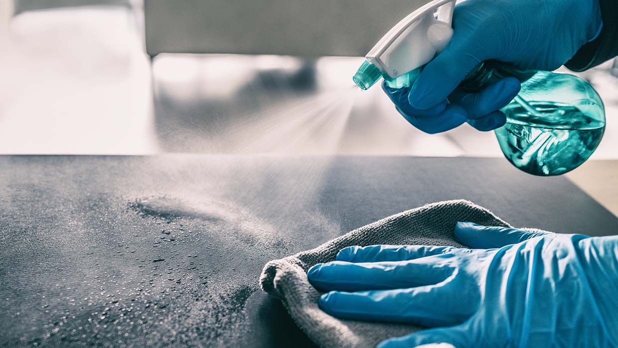 someone cleaning a table