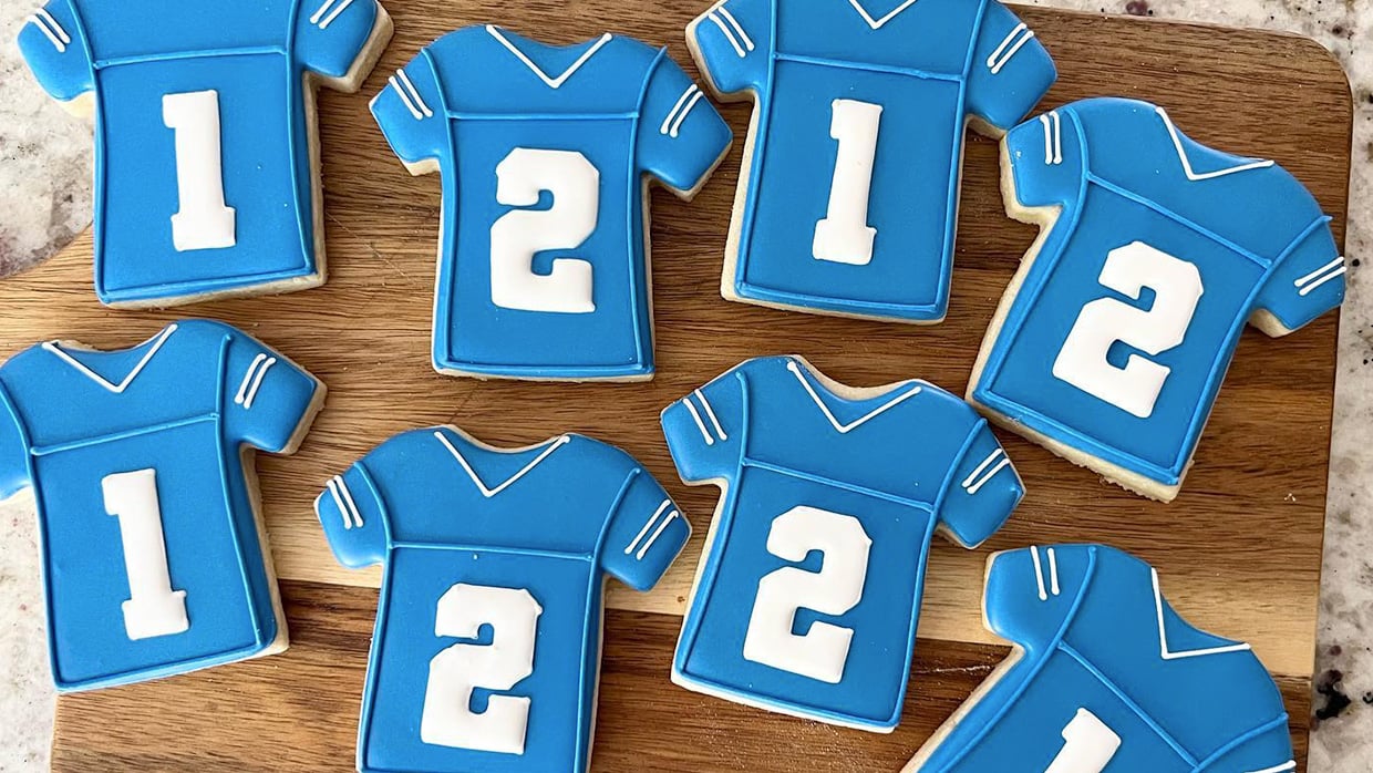 cookies in the shape of a soccer player shirt