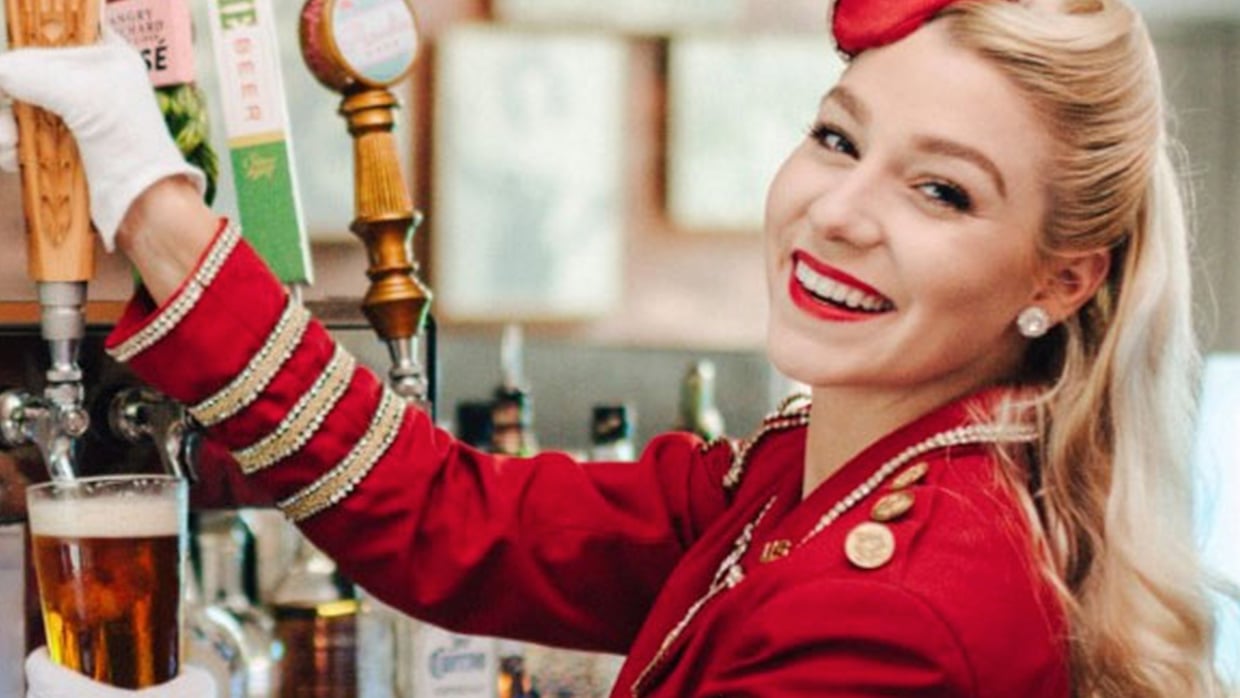 blonde woman in red uniform