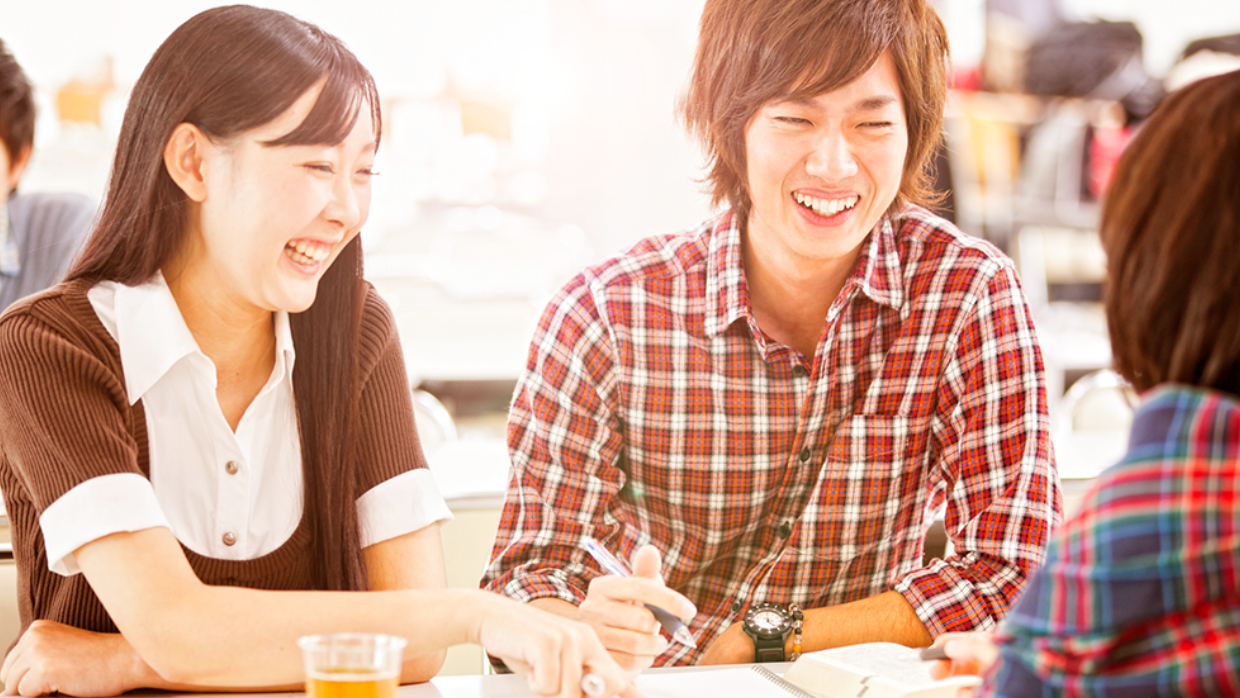 Students laughing with each other at lunch break.