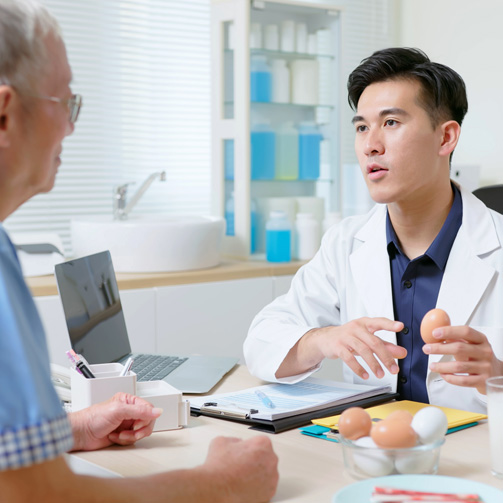 White man doctor nutritionist with a male patient