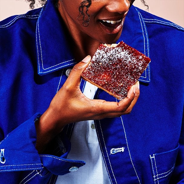 a woman eating a dessert