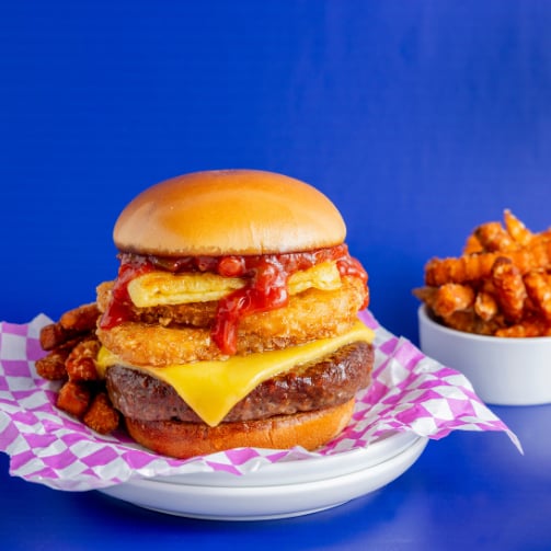 Juicy burger with a side of crispy fries.