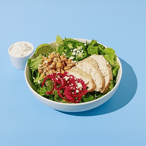 The Crave Experience: roasted chicken salad with leafy greens, corn, jalapeños, pickled onions and creamy dressing. 