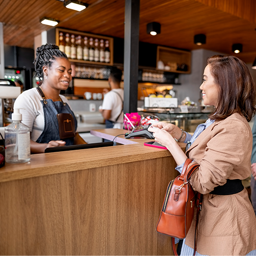 female paying at cash cafeteria