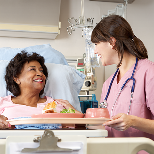female doctor with middle aged female patient