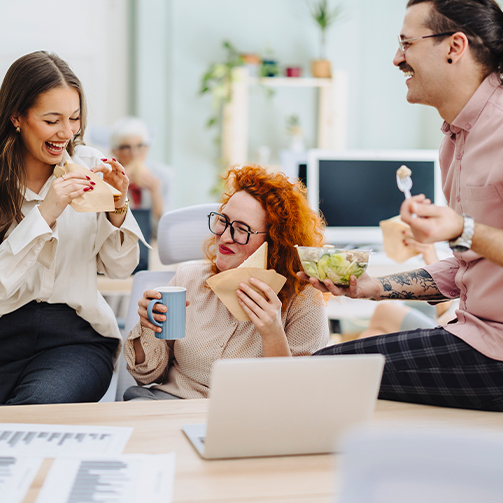 people smiling and eating something