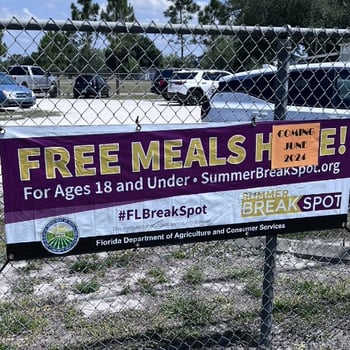Promotional sign for Florida's Summer BreakSpot program offering free meals to children and teens ages 18 and under.