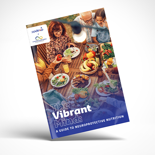 Cover of a nutrition guide featuring people gathered around an outdoor dining table with fresh meals, fruits, and vegetables, highlighting neuroprotective nutrition, healthy eating, and brain wellness.