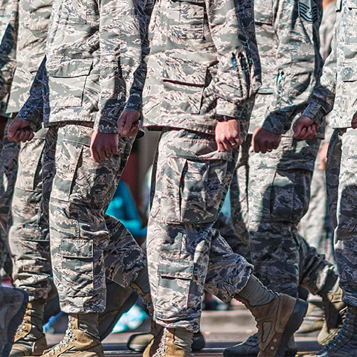 three soldiers walking