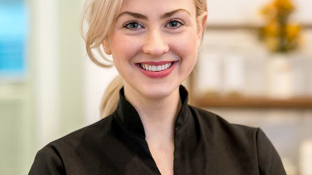 a woman smiling with a black t-shirt