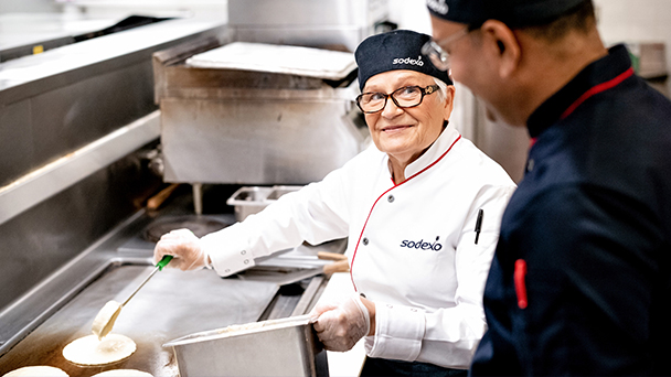 Old lady preparing pancakes