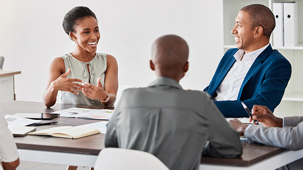 people smiling on a meeting