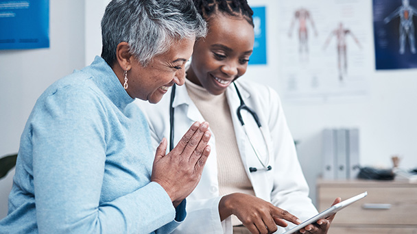 two women looking medical results