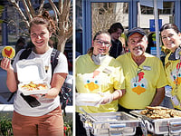 people holding food boxes