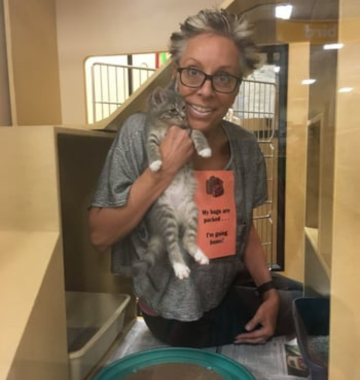 Rita Sanders holding a cat