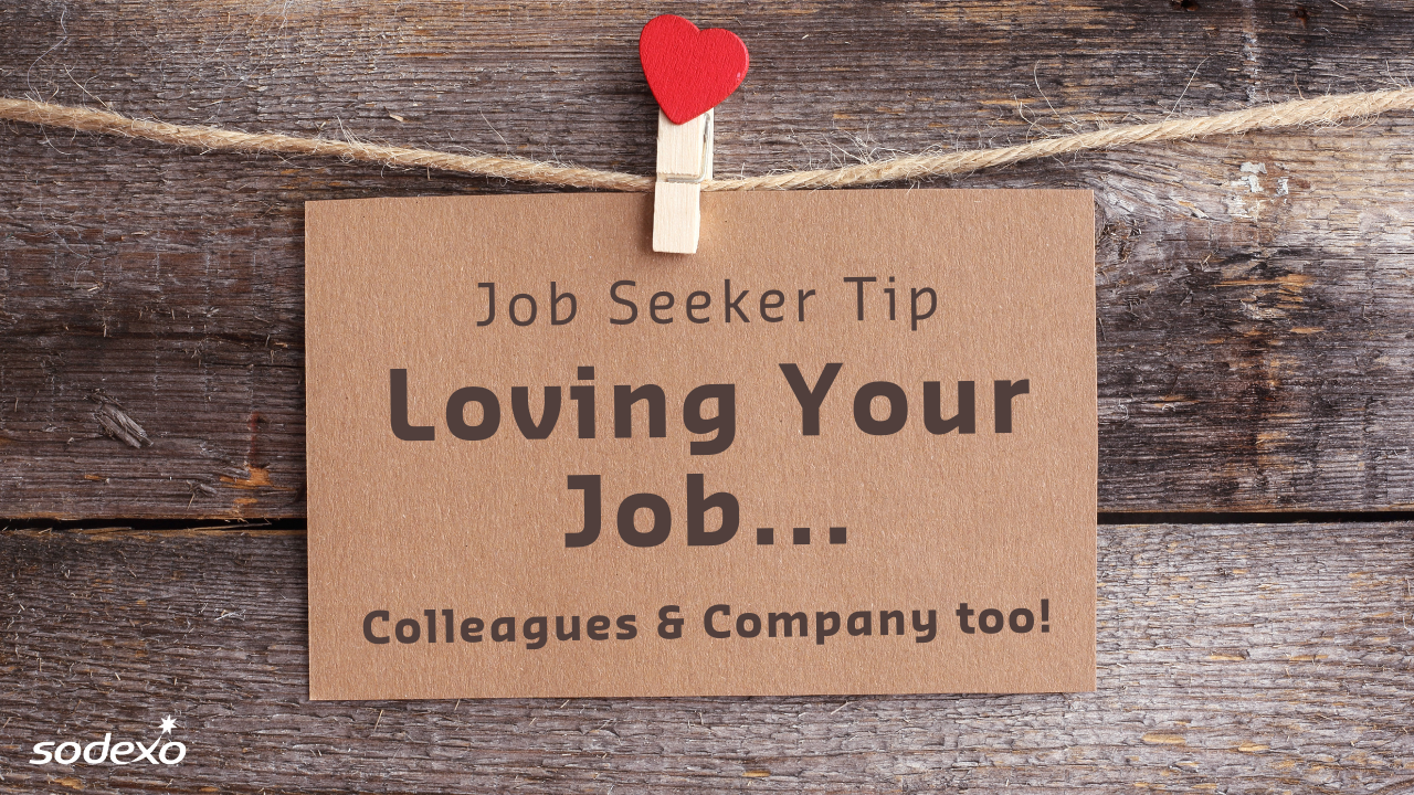 Brown card hanging on a string with red heart clip; text reads 'Job Seeker Tip: Loving Your Job... Colleagues & Company too!' with Sodexo logo in bottom left corner.