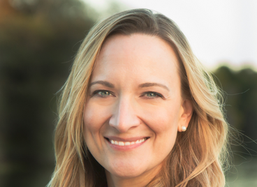 White blond woman smiling