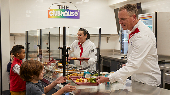 chefs serving lunch