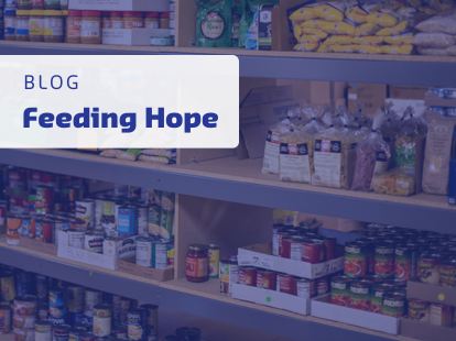 Image showing the text 'Feeding Hope' with a background of a food pantry. 