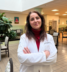 doctor with arms crossed smiling