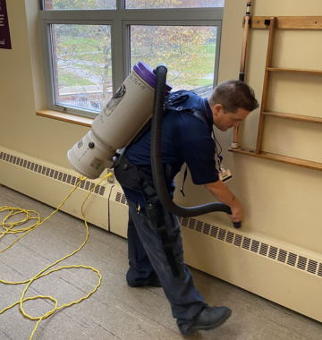 man cleaning a wall