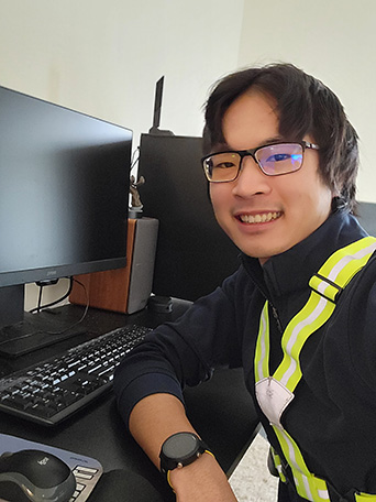 man smiling at office station