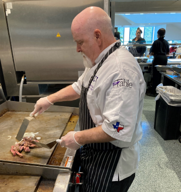 middle aged chef man cooking