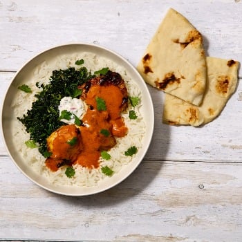 One & All chicken curry bowl with rice, greens and naan.