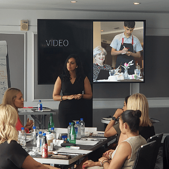 Hospitality expert Raabia Shafi leading an interactive training session with staff. 