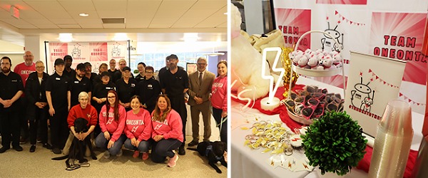 Group photo of SUNY Oneonta dining staff alongside a table of treats for employee appreciation.