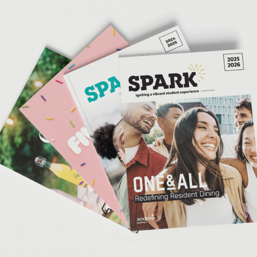 A stack of SPARK and CRAFT magazines fanned out on a clean surface. 
