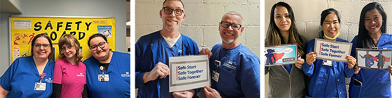People holding signs promoting safety, including 'Safe Start Safe Together Safe Forever' and 'ENGAGE'.