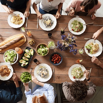 people eating on a wood table