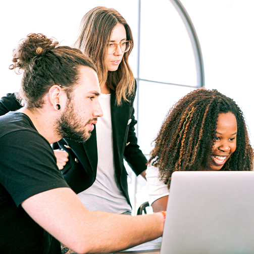 people looking at a laptop