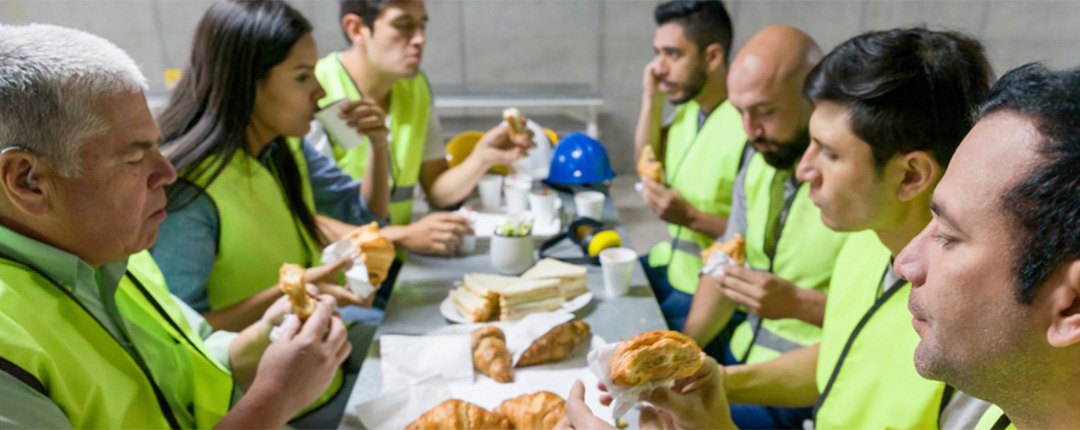 people with uniform eating