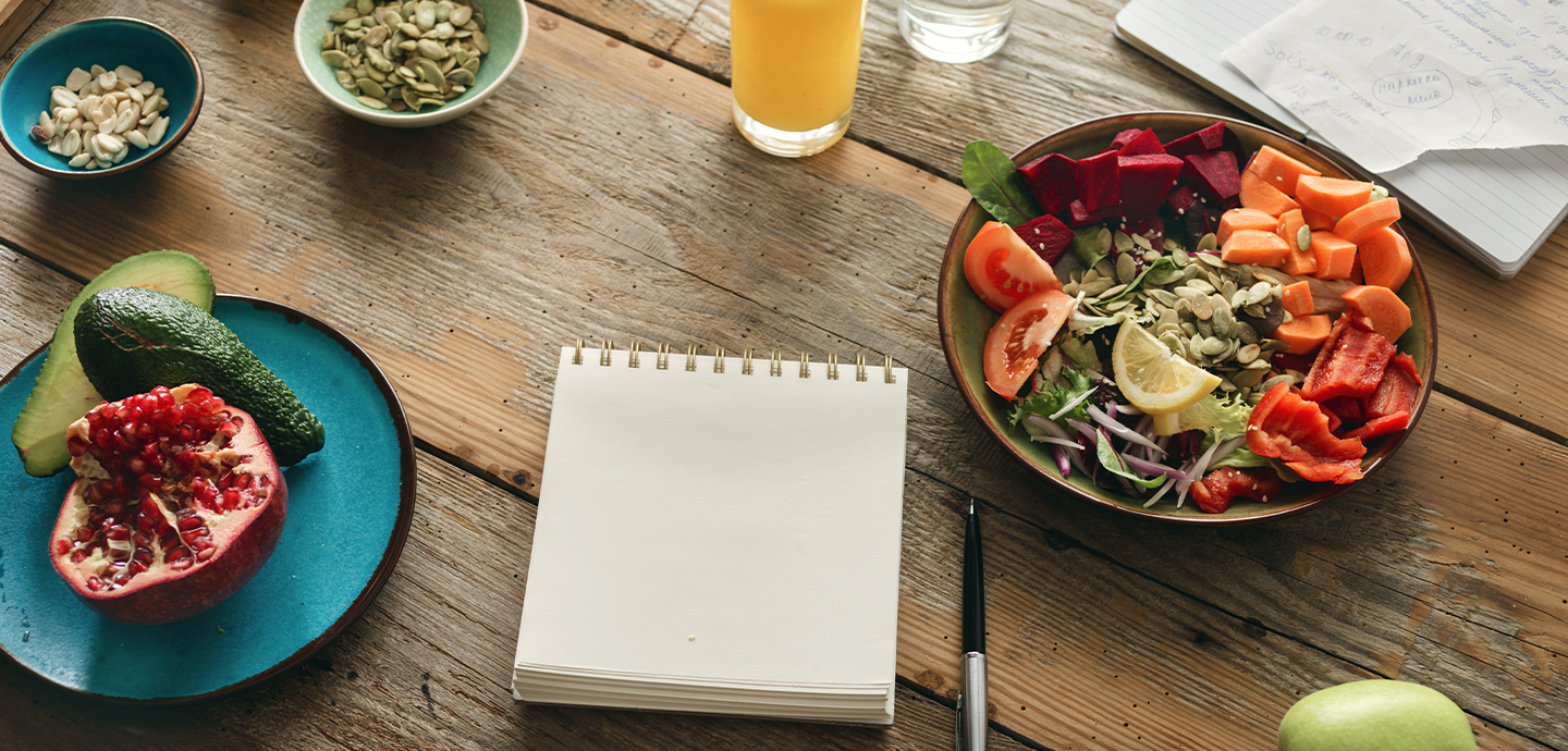 healthy food and notebook